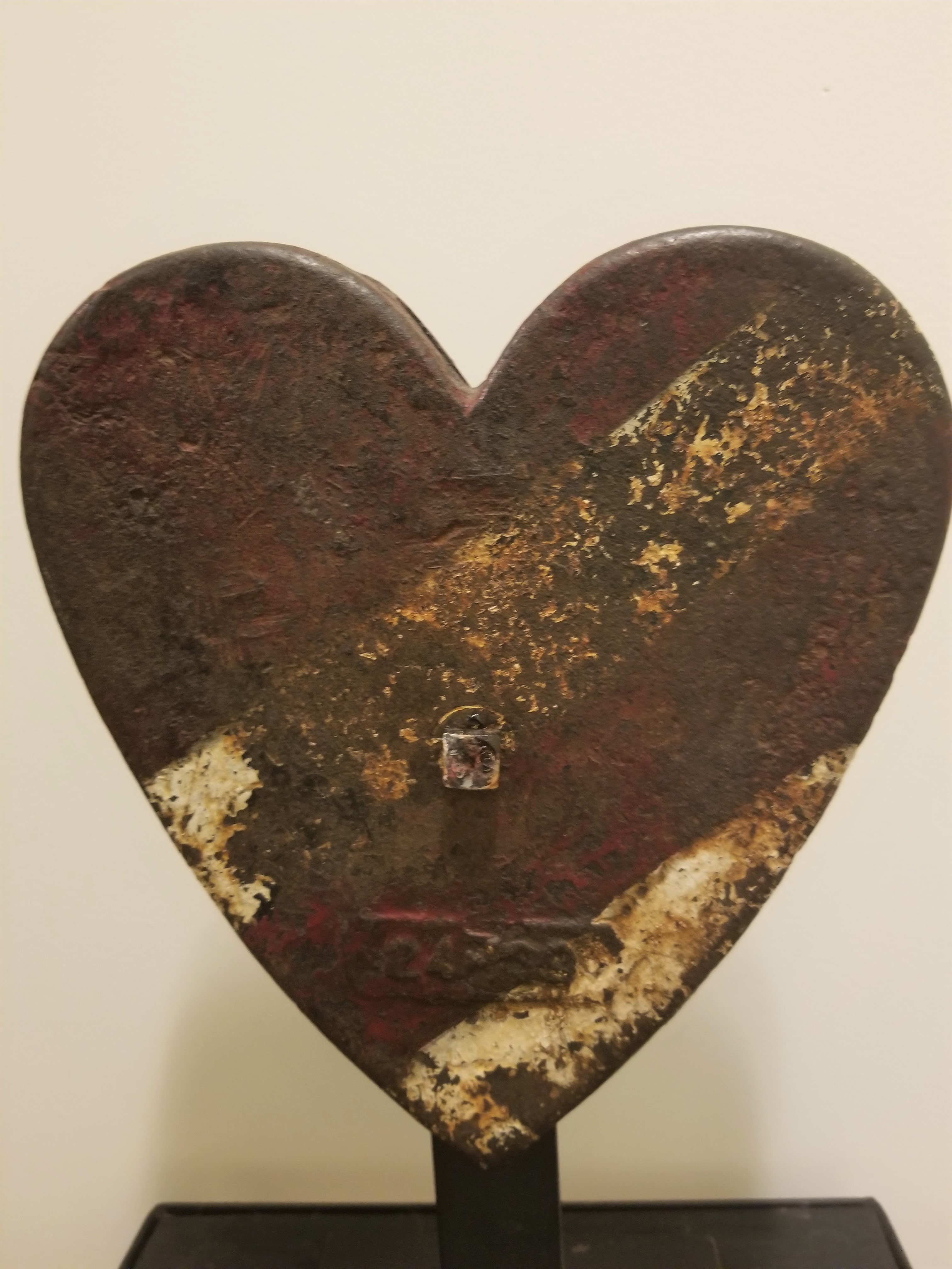 HEART WEIGHT IN OLD RED AND WHITE PAINT.